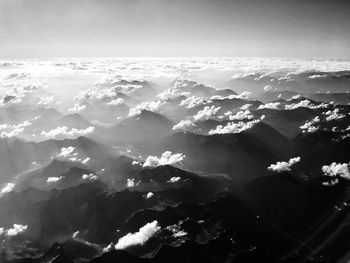 Aerial view of mountain range against sky