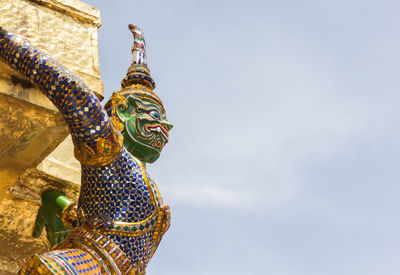 Low angle view of statue against sky