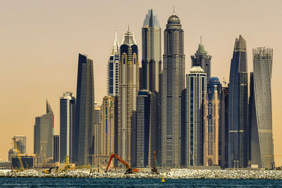 Modern buildings in city against sky