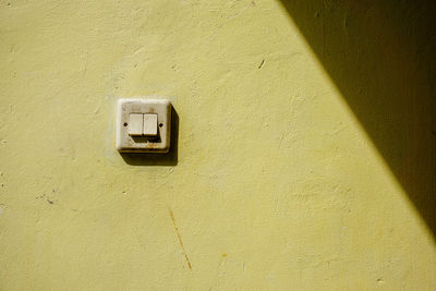 High angle view of light switch on wall