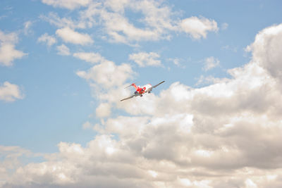 Low angle view of airplane flying in sky