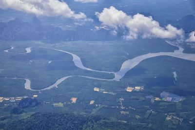 High angle view of land and city against sky