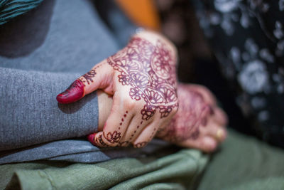 High angle view of woman hand on wall