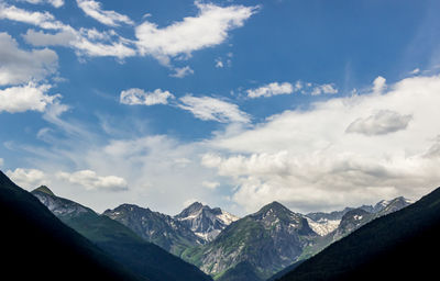 Scenic view of snowcapped mountains against sky