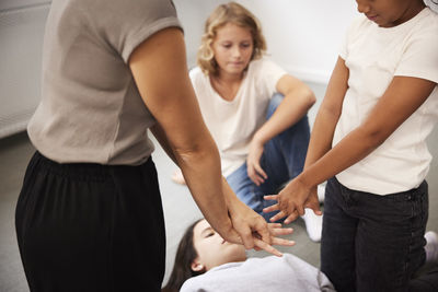 Teacher giving first aid training