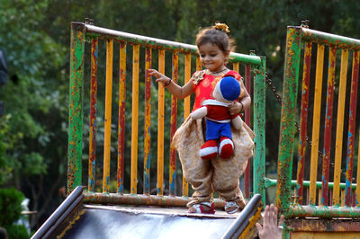 High angle view of cute girl around railing