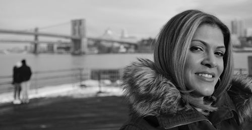 Close-up portrait of young woman in city