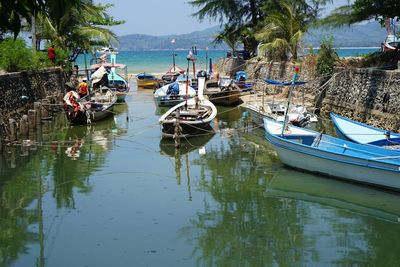 Panoramic view of boats moored in sea