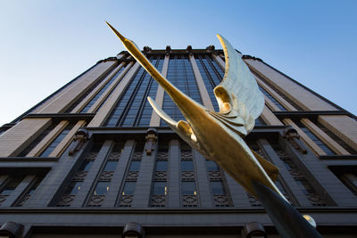 Low angle view of building against blue sky