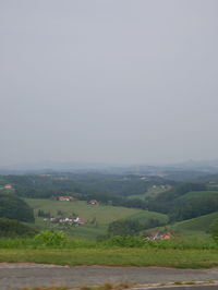 Scenic view of agricultural field against clear sky