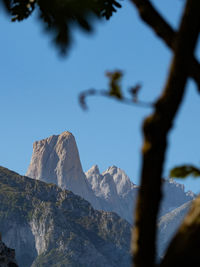 Low angle view of snowcapped mountain against sky