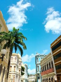 Low angle view of buildings against blue sky
