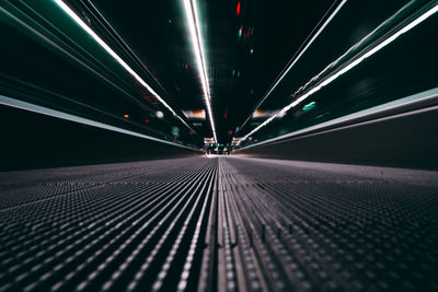 Low angle view of illuminated tunnel