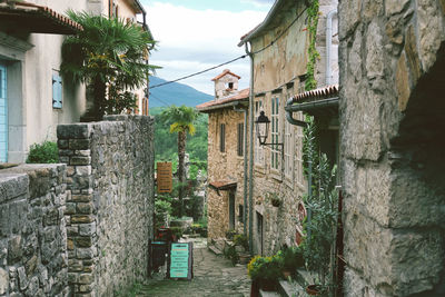 Alley amidst buildings in city