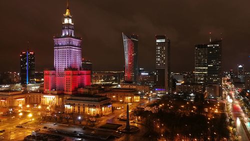 Illuminated buildings in city at night