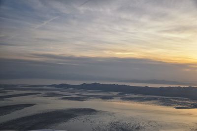 Scenic view of landscape against sky during sunset