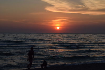 Silhouette of people on beach