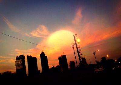 Low angle view of building against sky at sunset