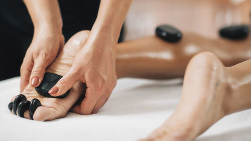 Hot stone foot reflexology massage