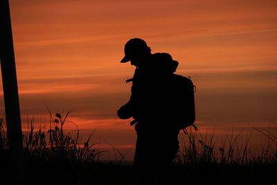 Silhouette of people at sunset