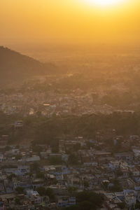 High angle view of townscape against sky at sunset