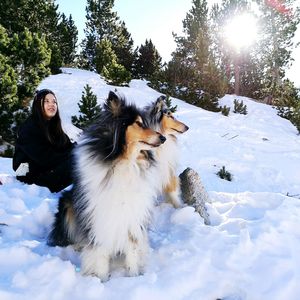 Young woman with dogs in winter