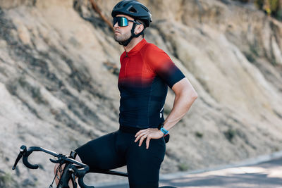 Rear view of man riding bicycle