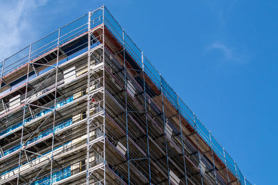 Low angle view of building against blue sky