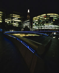 Illuminated buildings in city at night