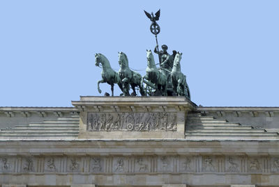 Low angle view of statue against sky