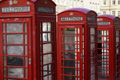 Red telephone booths in city