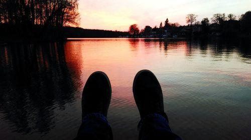 Scenic view of lake at sunset