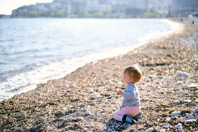 Rear view of boy on beach