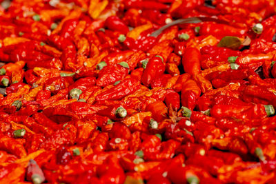 Full frame shot of red chili peppers for sale in market