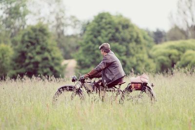 Man on old motorbike