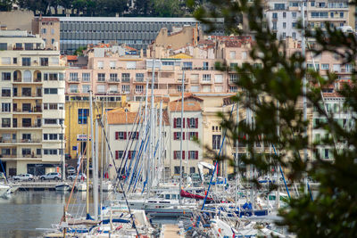 Boats moored at harbor