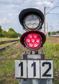 Small two-sections railway shunting semaphore with a colorlight signals near the railway tracks