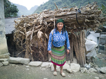 Portrait of a smiling young woman standing outdoors