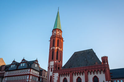 Low angle view of building against clear blue sky