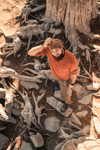 High angle view of man standing on rock
