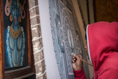 Close-up of hand with text