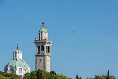 Low angle view of building against blue sky