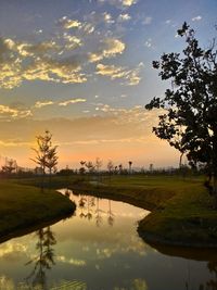 Scenic view of lake against sky during sunset