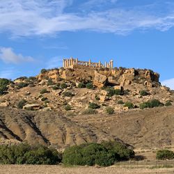 Old ruins on mountain against sky