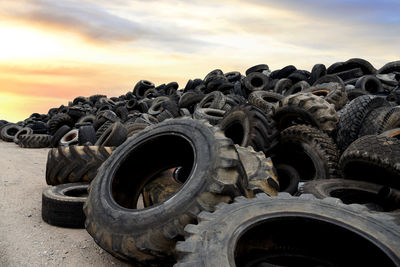 Close-up of abandoned truck on field against sky