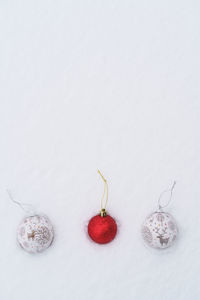 Directly above shot of baubles over white background