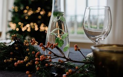 Flavoured water in a vase on a decorated dinner table at christmas