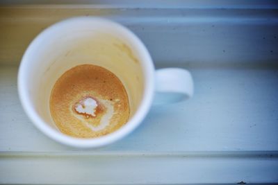 High angle view of heart shape in coffee cup