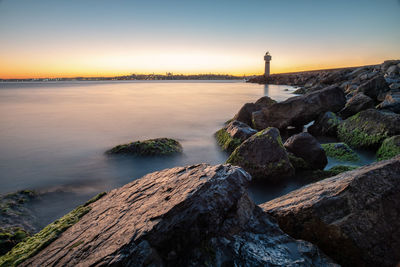 Scenic view of sea against sky during sunset