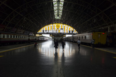 People walking on platform at railroad station